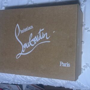 Christian Louboutin cream pumps